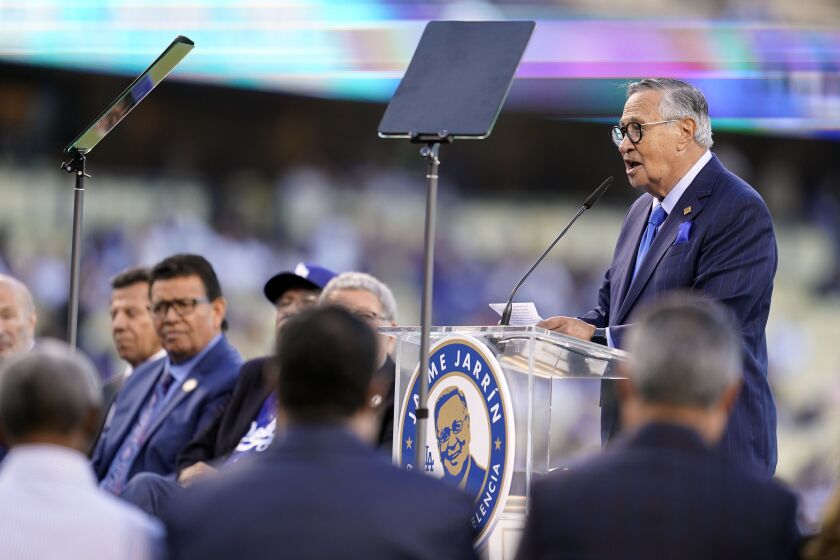 Los Angeles Dodgers Spanish language broadcaster Jaime Jarrin speaks during a ceremony honoring him before a baseball game between the Los Angeles Dodgers and the Colorado Rockies Saturday, Oct. 1, 2022, in Los Angeles. Jarrin is retiring at the end of the season. (AP Photo/Marcio Jose Sanchez)