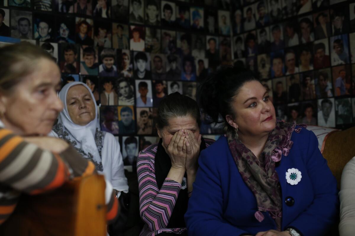 Women who lost family members in Srebrenica react as they watch a broadcast of the sentencing of Radovan Karadzic in Tuzla, Bosnia on March 24.