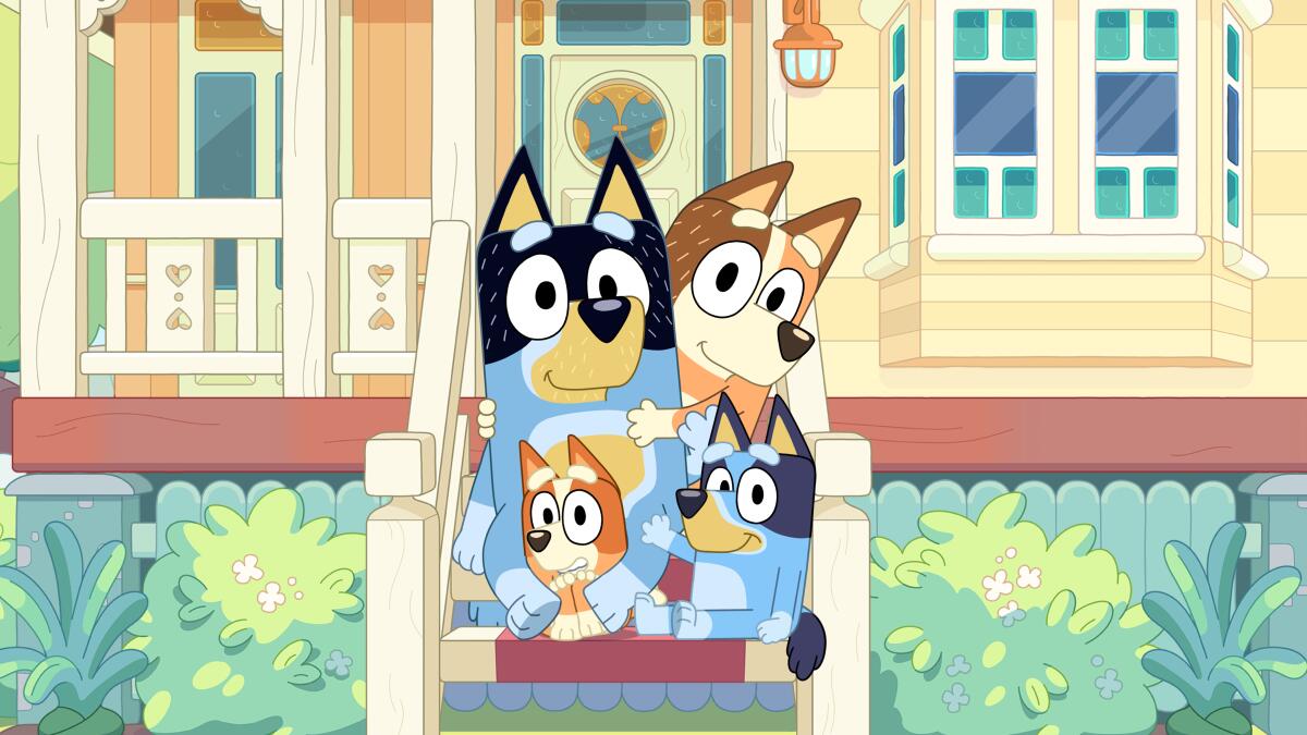 Four animated dogs on the front steps of a house