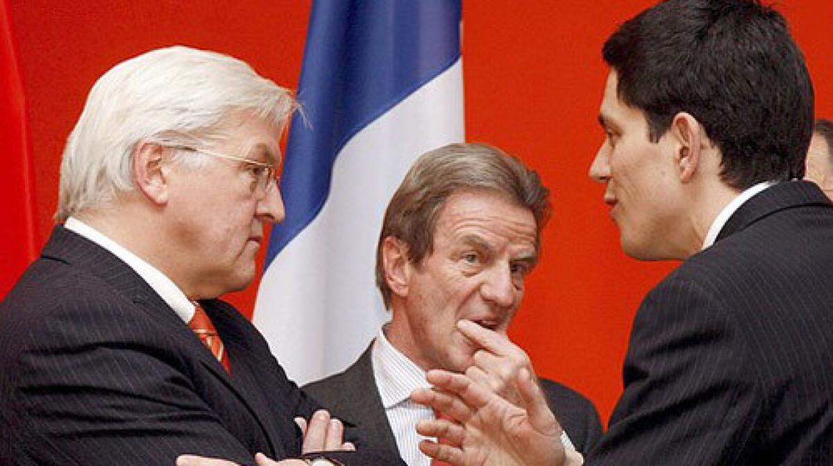 German Foreign Minister Frank-Walter Steinmeier (L) chats with his his counterparts Bernard Kouchner (C, France) and David Miliband (R, GB) in Berlin, Germany, on the possibilities of an UN resolution against Iran.