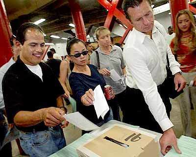 Supermarket employees cast ballots at the Los Angeles Sports Arena on October 8, 2003, in a vote that ultimately authorized the strike.