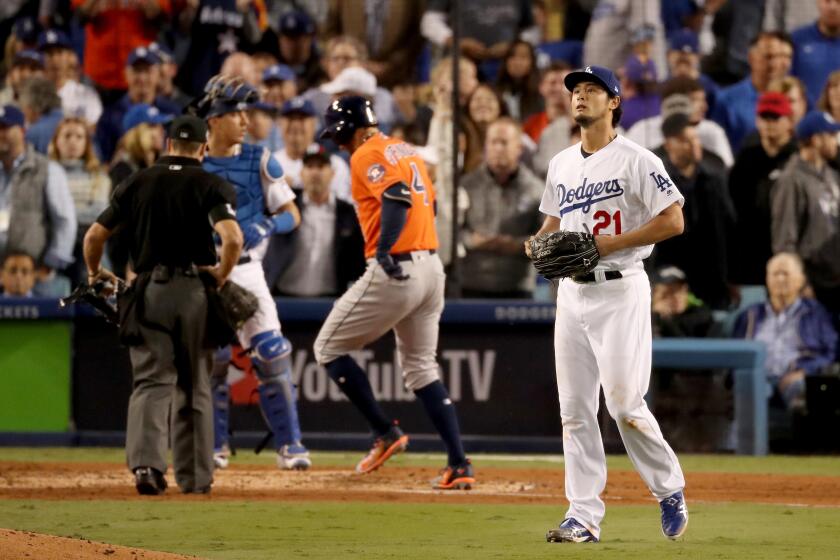 LOS ANGELES, CA - NOVEMBER 01: Yu Darvish #21 of the Los Angeles Dodgers reacts after George Springer #4 of the Houston Astros hit a two-run home run during the second inning in game seven of the 2017 World Series at Dodger Stadium on November 1, 2017 in Los Angeles, California. (Photo by Christian Petersen/Getty Images)