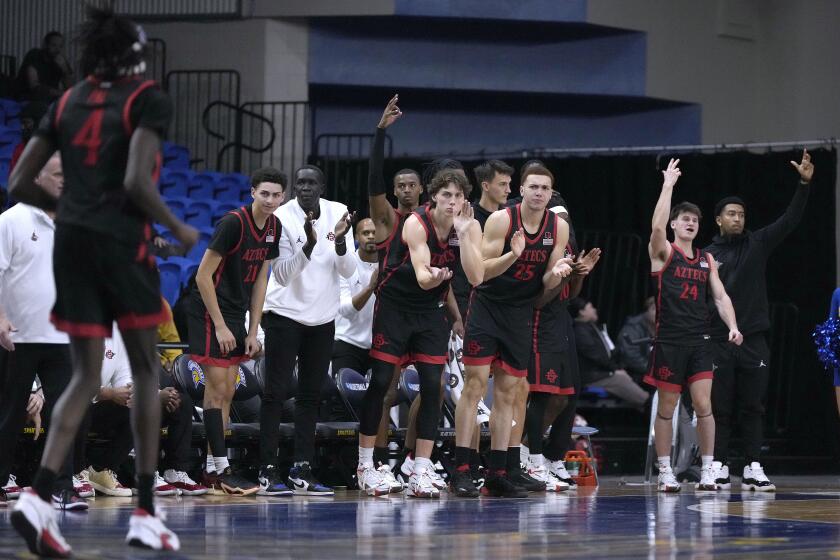 San Diego State players react after forward Jay Pal (4) made a 3-point shot against San Jose State during the second half of an NCAA college basketball game Tuesday, Jan. 9, 2024, in San Jose, Calif. San Diego State won 81-78. (AP Photo/Tony Avelar)