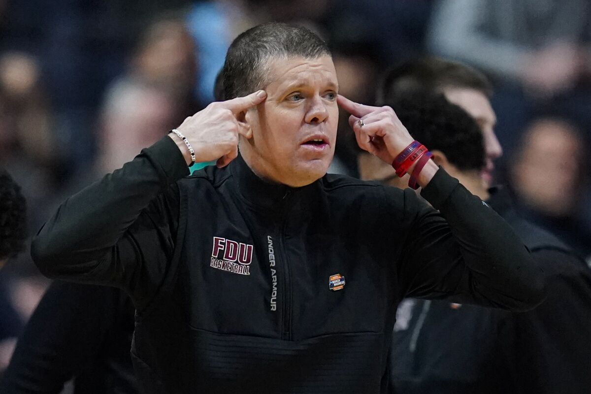 Fairleigh Dickinson head coach Tobin Anderson yells to his team as they played Florida Atlantic in the second half of a second-round college basketball game in the men's NCAA Tournament in Columbus, Ohio, Sunday, March 19, 2023. (AP Photo/Michael Conroy)