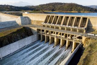 FILE - Water flows through the Oroville Spillway at Lake Oroville on March 25, 2023, in Butte County, Calif. Regulators say California will provide 100% of the water requested by cities and farms for the first time in years thanks to winter storms that filled reservoirs and runoff from a record snowpack. (AP Photo/Noah Berger, File)