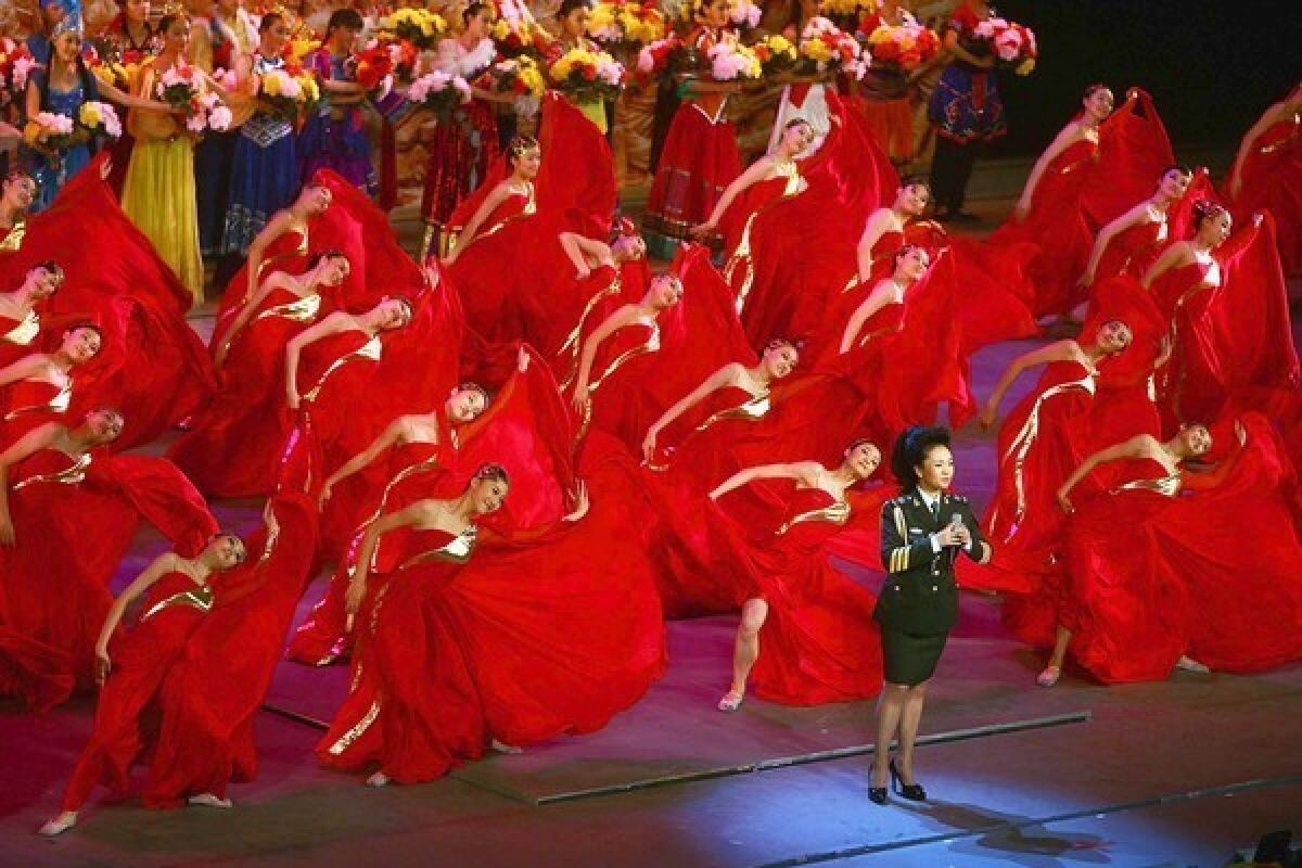 Peng Liyuan sings during a national gala honoring the Chinese army in 2007. Her husband, Xi Jinping, is soon to become president of China.