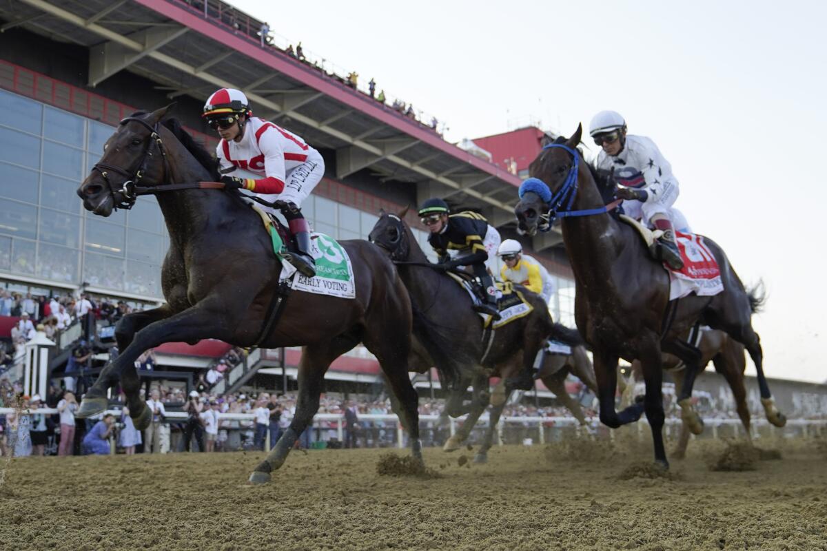 Horses run in the 2022 Preakness Stakes.
