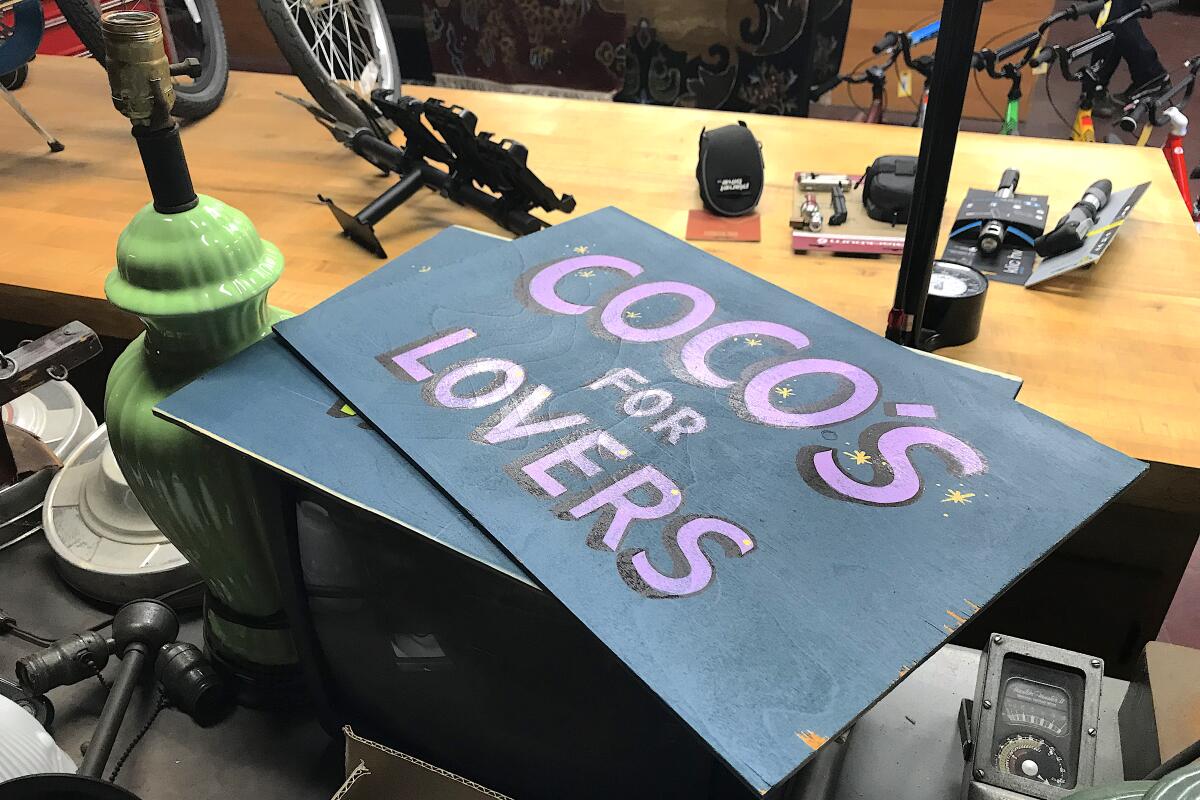 A sign on a workbench says "Coco's for Lovers"