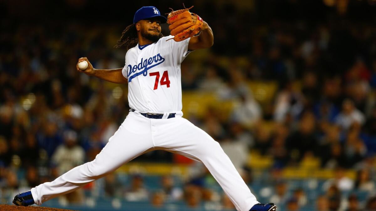 Dodgers relief pitcher Kenley Jansen pitches against the San Francisco Giants during the ninth inning at Dodger Stadium on Tuesday.
