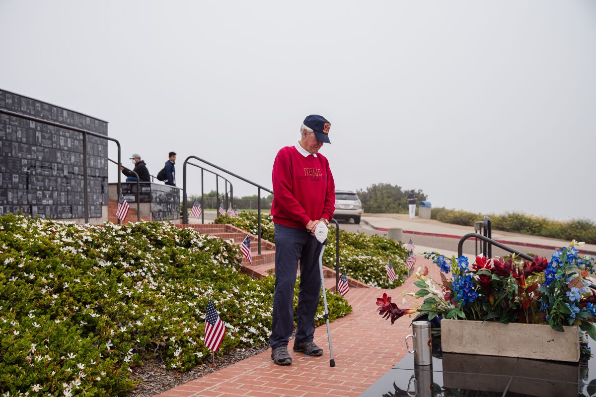 Retired Marine Lt. Col. Tony Anthony pauses at Mount Soledad National Veterans Memorial on May 25 to pay tribute to those with whom he fought in the Vietnam War. Johnson served two tours in Vietnam and was in the service for 43 years.