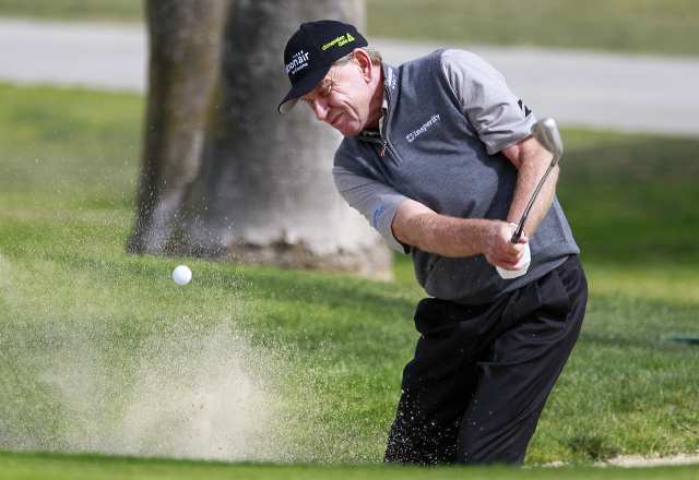 Nick Price hits out of the bunker on 15 during the pro-am at the Toshiba Classic on Thursday.