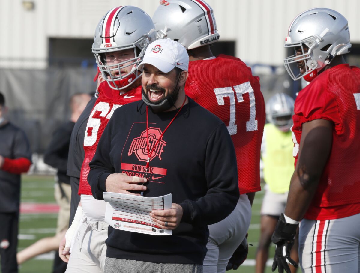 FILE - Ohio State coach Ryan Day is seen during an NCAA college football practice in Columbus, Ohio, in this Monday, April 5, 2021, file photo. Third-year Ohio State coach Ryan Day opens a preseason camp for the first time without a good idea of who will be the starting quarterback. “If I did, I'd probably sleep a little better right now, but I don't,” said Day, who is 23-2 in his first two seasons since taking over for Urban Meyer. (AP Photo/Paul Vernon, File)
