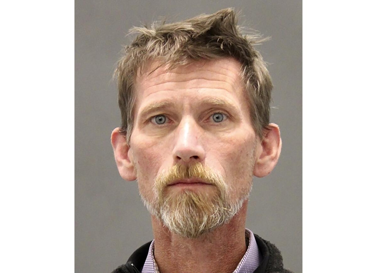 A man in a police booking photo