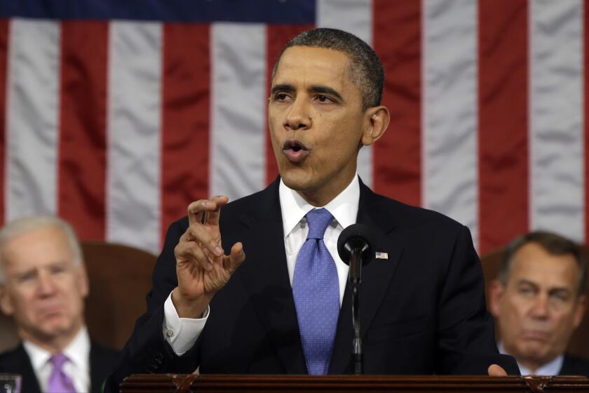 President Obama, flanked by Vice President Joe Biden and House Speaker John Boehner of Ohio, gestures as he gives his State of the Union address.