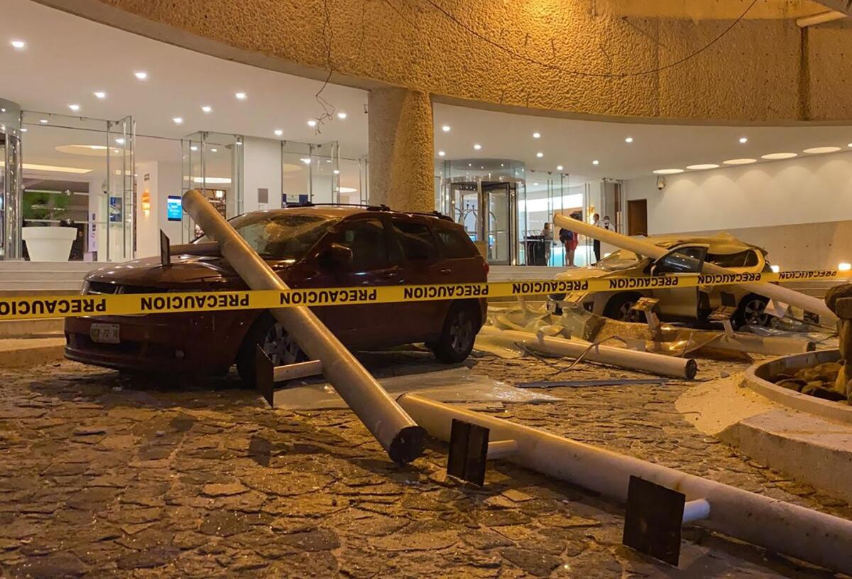 Damaged cars outside a hotel 