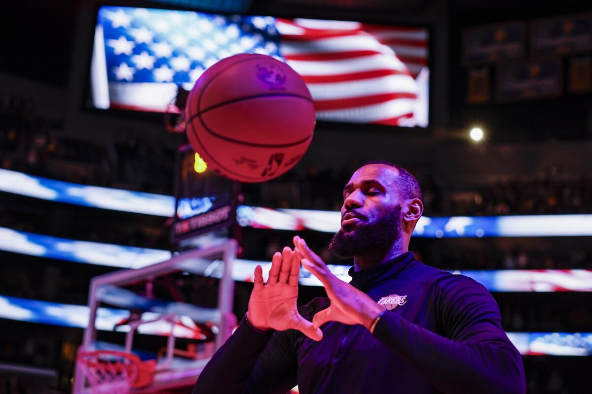 LeBron James briefly meditates during the national anthem before a game against the Toronto Raptors on Jan. 9.
