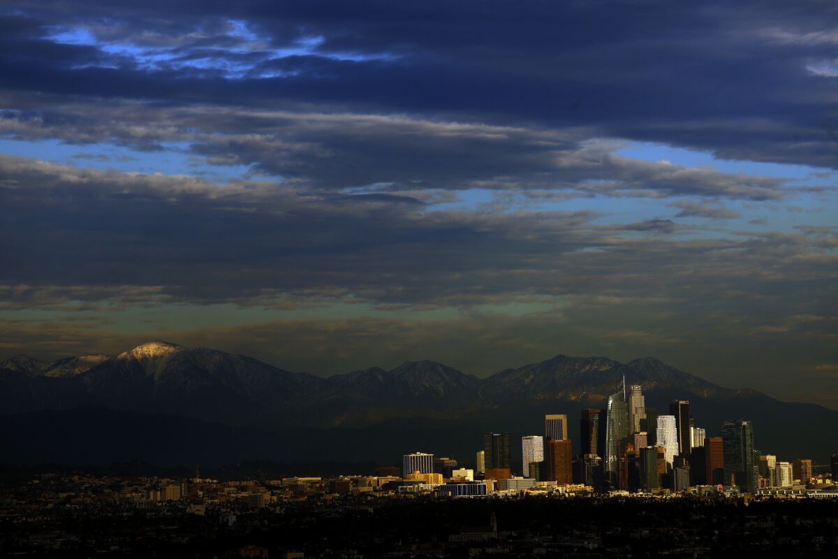 Clouds fill the sky over the city of Los Angeles as seen from the Baldwin Hills Scenic Overlook.