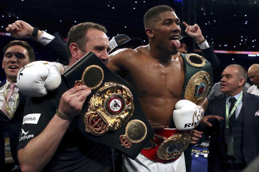 Anthony Joshua of Britain celebrates after defeating Wladimir Klitschko of Ukraine by technical knockout for the heavyweight title.