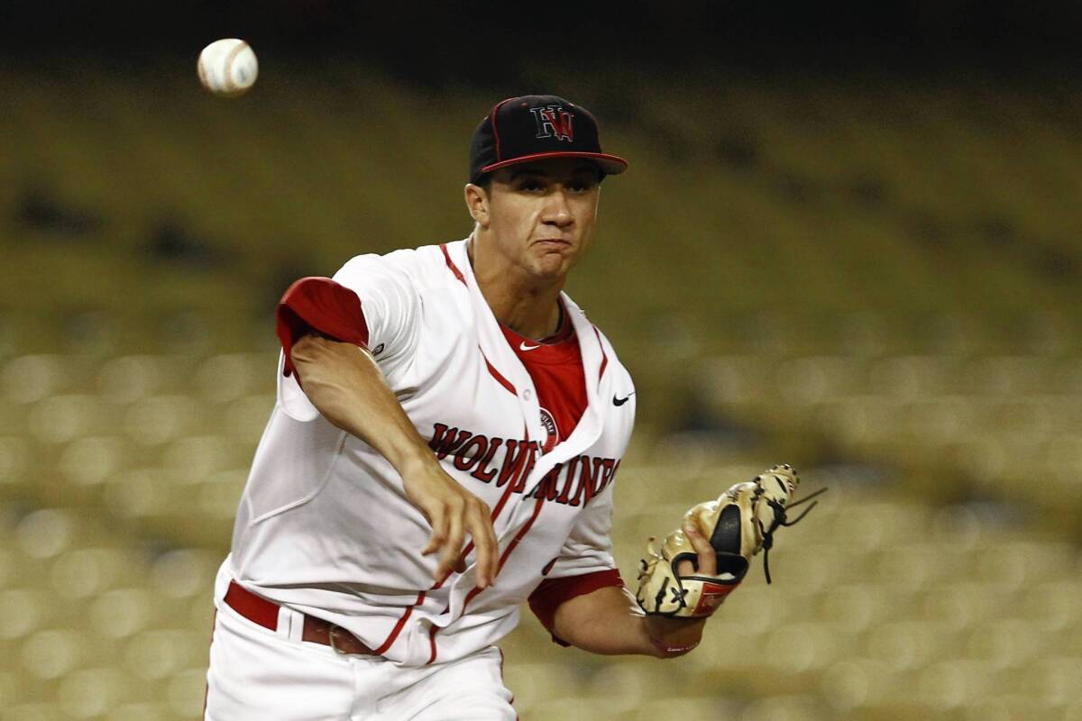 Hardvard-Westlake pitcher Jack Flaherty throws to first base during the Southern Section Division 1 championship game.
