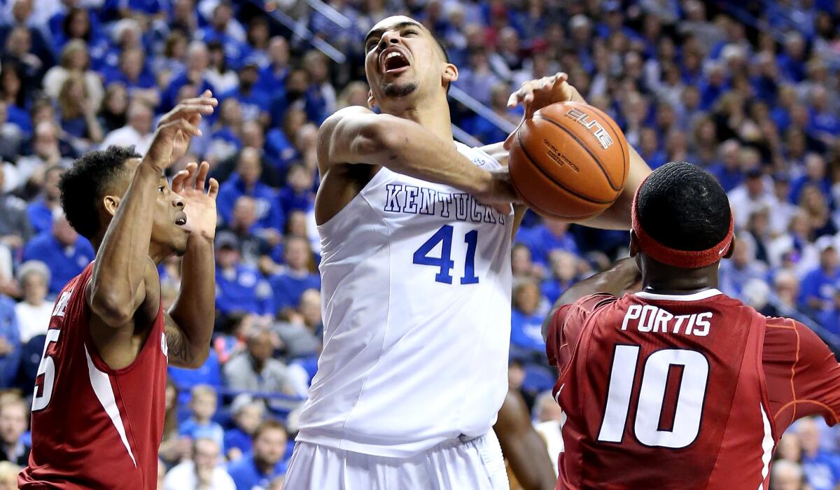 Kentucky forward Trey Lyles is fouled as he tries to score inside against Arkansas on Saturday.