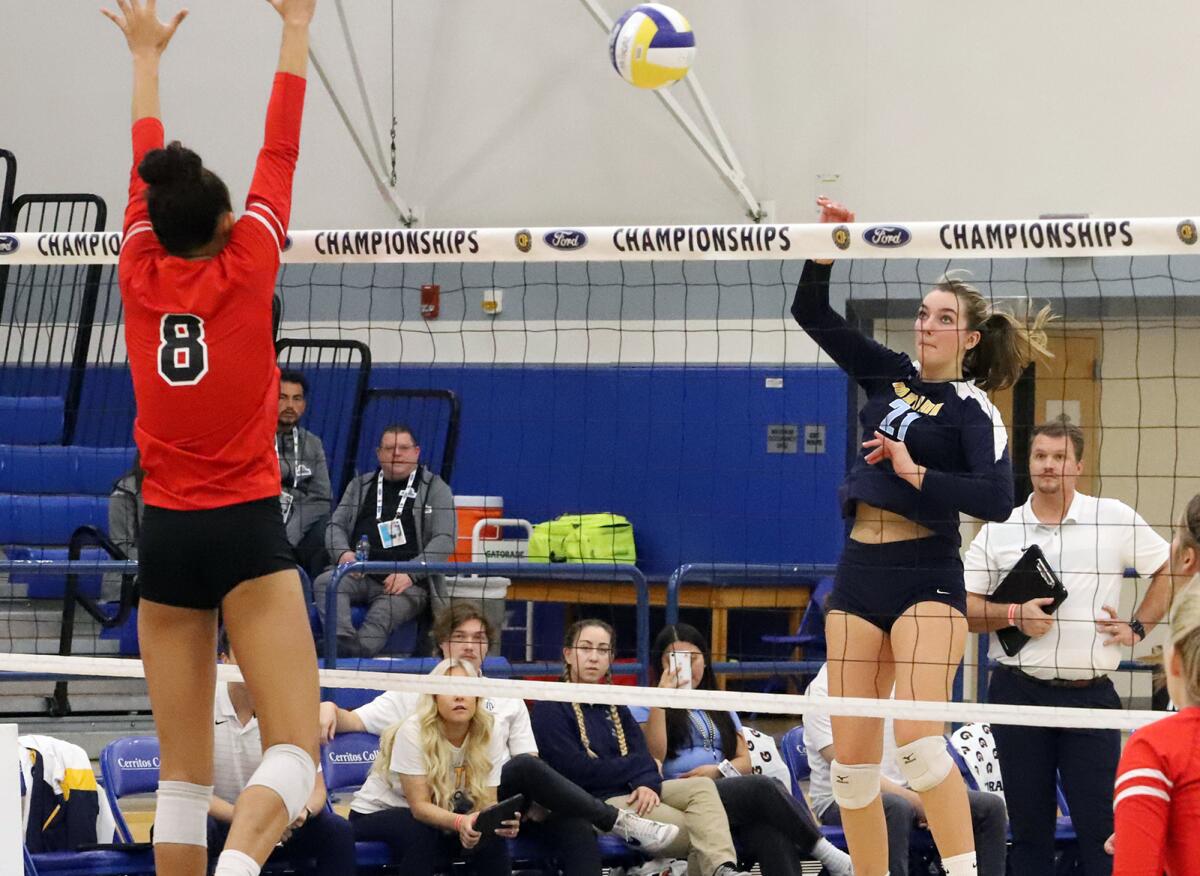 Marina's Dominique Vadeboncoeur (21) hits against Buckley's Sophia Wolfson (8) in a girls' volleyball final.