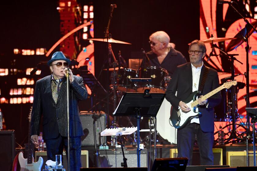 Van Morrison (L) and Eric Clapton perform on stage at London's O2 Arena on March 03, 2020