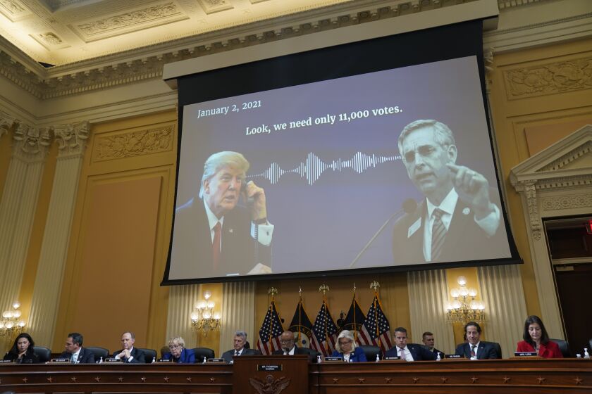 WASHINGTON, DC - OCTOBER 13: An audio recording of former President Donald Trump speaking to Georgia Secretary of State Brad Raffensperger is played during a hearing of the House Select Committee to Investigate the January 6th Attack on the United States Capitol in the Cannon House Office Building on Thursday, Oct. 13, 2022 in Washington, DC. The bipartisan Select Committee to Investigate the January 6th Attack On the United States Capitol has spent nearly a year conducting more than 1,000 interviews, reviewed more than 140,000 documents day of the attack. (Kent Nishimura / Los Angeles Times)