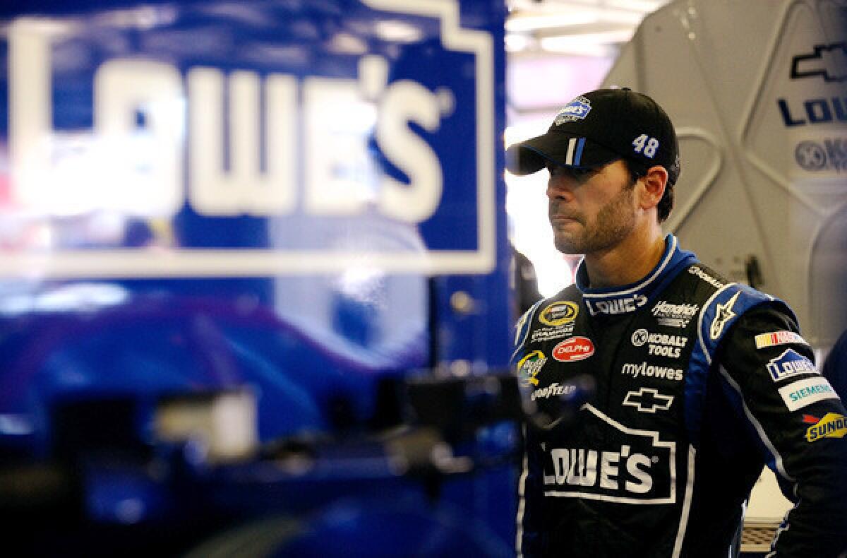 NASCAR driver Jimmie Johnson waits in the garage during practice at Texas Motor Speedway on Friday.