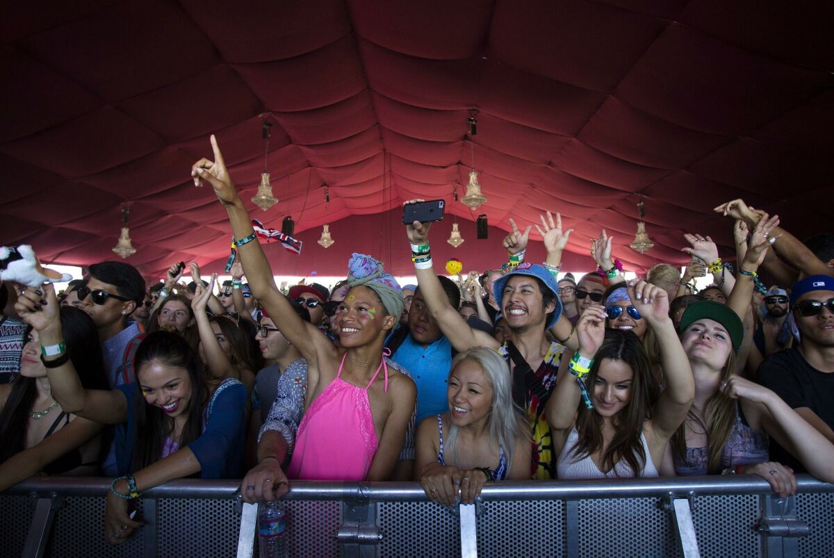 Fans watch the performance of Cashmere Cat on the second day of the Coachella Valley Music & Arts Festival last April. Nearly 100,000 people will attend each day during this year’s six-day event.
