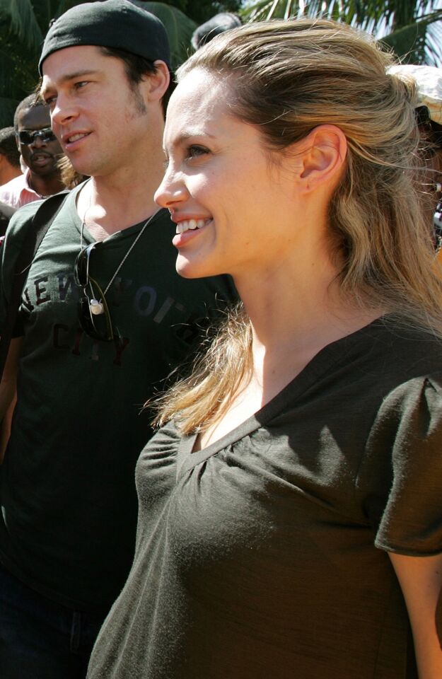 Brad Pitt and Angelina Jolie visit the Immaculate Conception School in Port au Prince, Haiti, on Jan. 13, 2006.