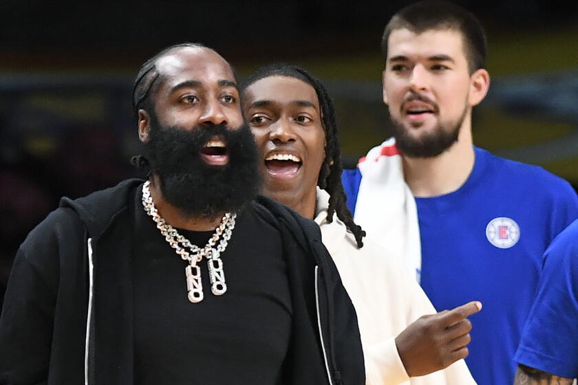 Los Angeles, California November 1, 2023- Newly acquired Clippers player James Harden wears street clothes on the bench during a game against the Lakers at Crypto.com Wednesday. (Wally Skalij/Los Angeles Times)