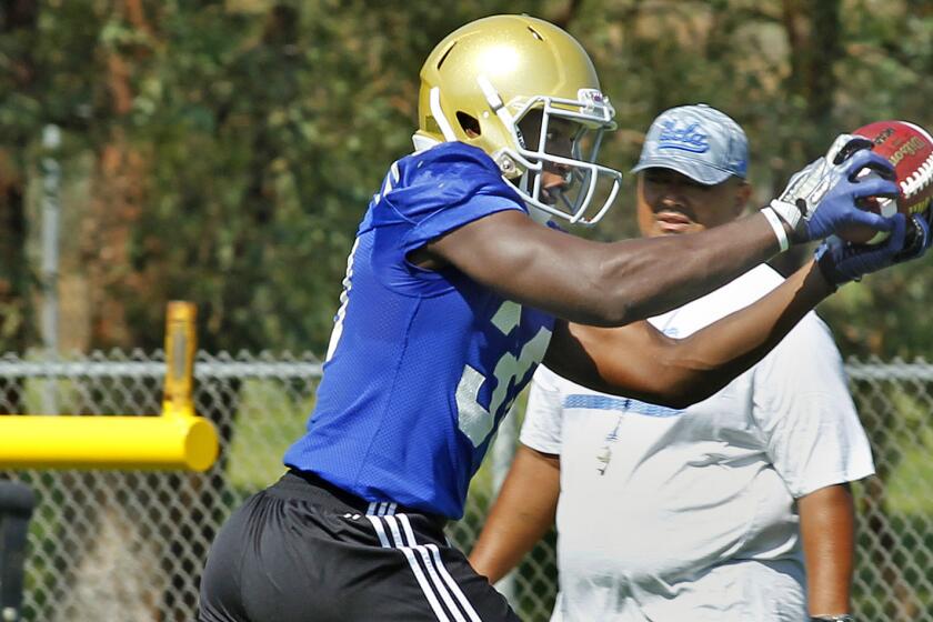 UCLA's Myles Jack catches a pass during a team practice session at Cal State San Bernardino on Aug. 4.