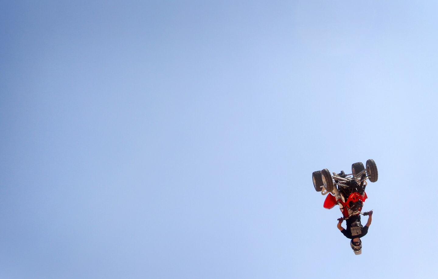 Caleb Moore performs on a quad bike during Burn Ciutatthe de Palma exhibition on the Spanish island of Mallorca in 2008. Moore was killed when he crahed his snowmobile during competition at the Winter X-Games. He was 25.