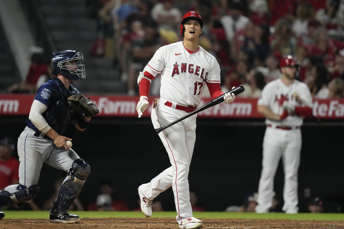 Angels designated hitter Shohei Ohtani reacts after hitting a foul ball against the Seattle Mariners.