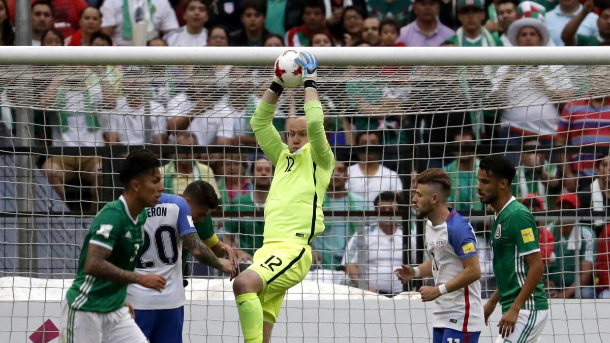 American goalkeeper Brad Guzan grabs the ball after Mexico made a pass into the penalty box Sunday.