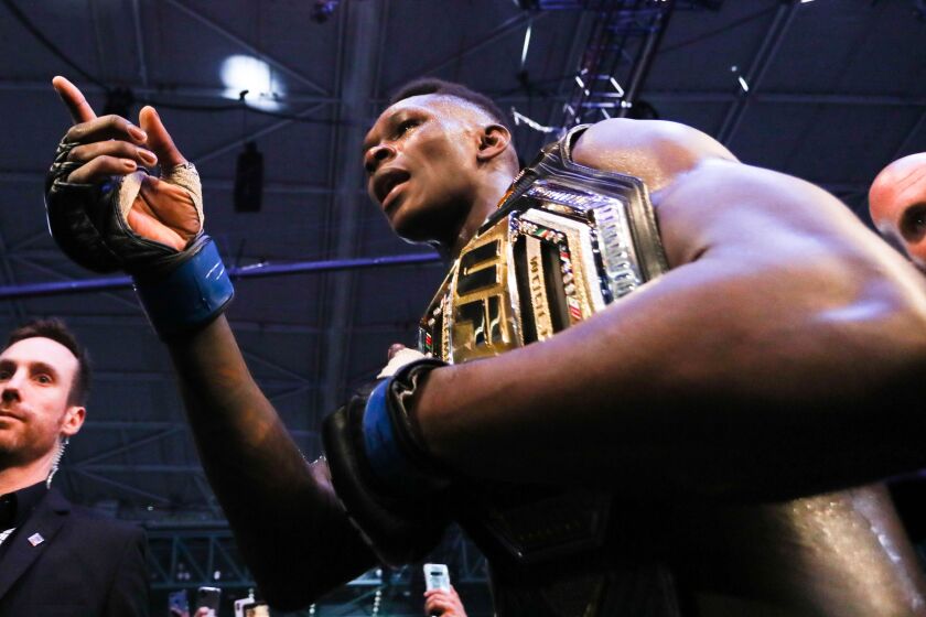 Israel Adesanya puts his UFC middleweight championship belt on the line against Yoel Romero in the main event from T-Mobile Arena in Las Vegas.