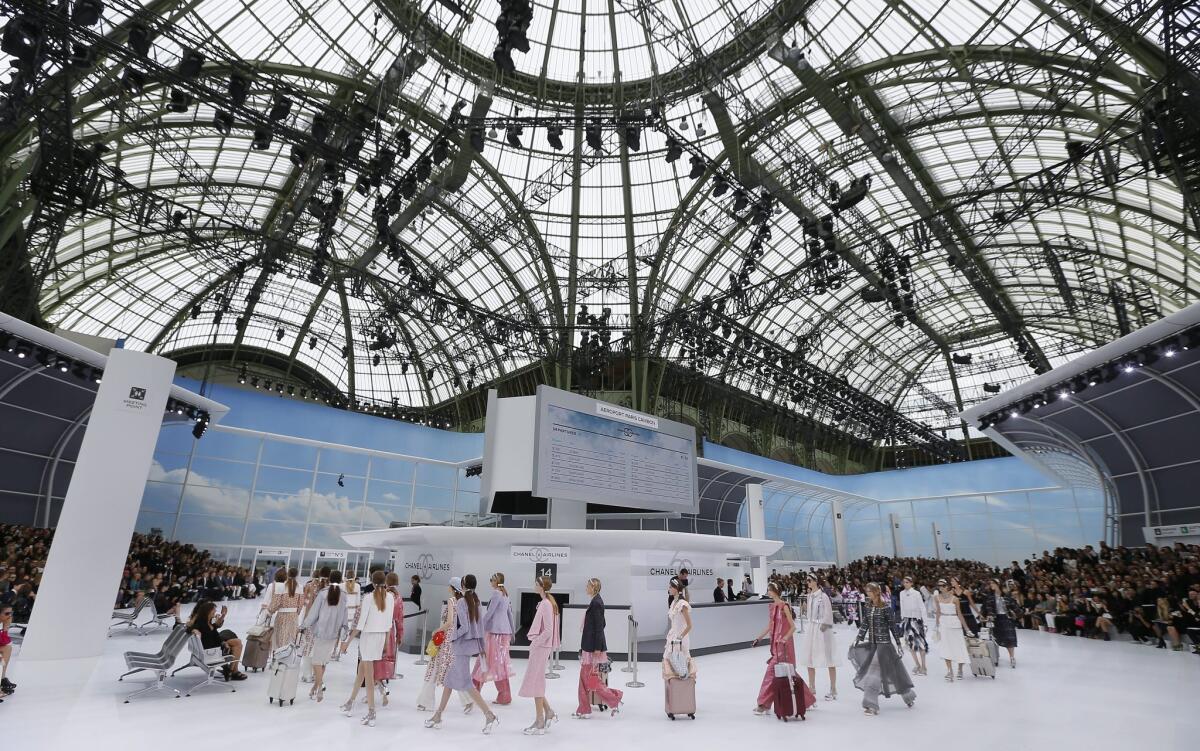 Flying on Chanel Airlines, an airline created at the Grand Palais for Paris Fashion Week.