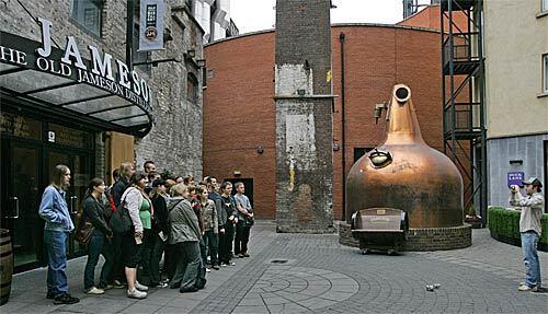A writer's recent do-it-yourself tour covered four whiskey tasting centers in Ireland. Last on the list was the Old Jameson Distillery, built in 1780 in Dublin. Visitors interested in seeing the Jameson operation can tour facilities in Dublin or Midleton, Ireland. Here, a group of visitors poses in front of the entrance to the Dublin facility.