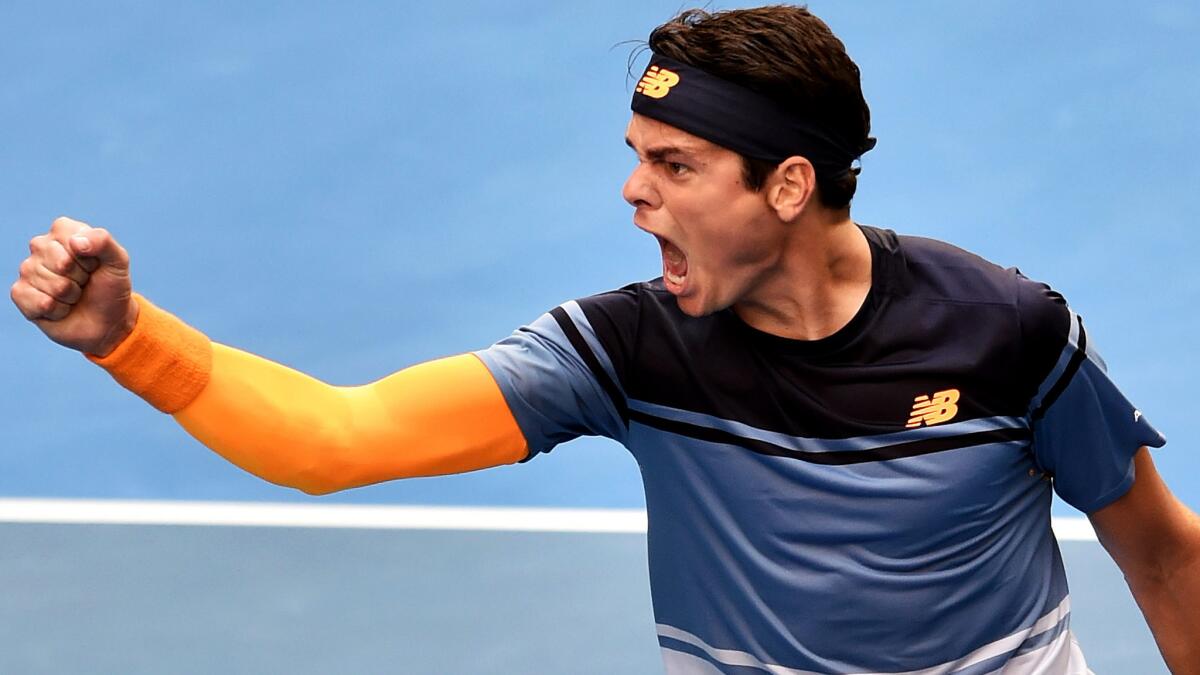 Milos Raonic celebrates after defeating Stan Wawrinka in a fourth-round match at the Australian Open on Monday.