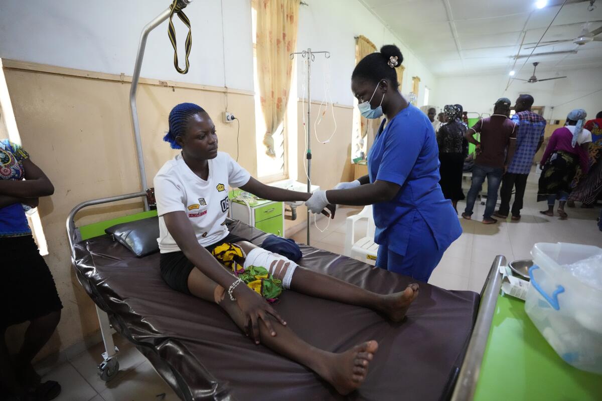 A young woman is treated in a hospital bed