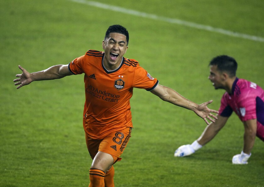Houston Dynamo FC midfielder Memo Rodriguez (8) celebrates after scoring a goal against the San Jose Earthquakes during the first half of an MLS soccer game at BBVA Stadium on Friday, April 16, 2021, in Houston. (Godofredo A. Vásquez/Houston Chronicle via AP)