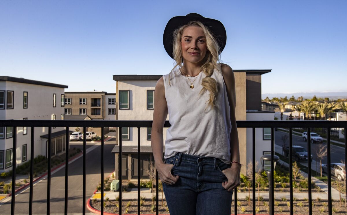 Tera Whipple, a tenant at Fresno apartment development the Row, where her balcony has views of the Sierra Nevada.