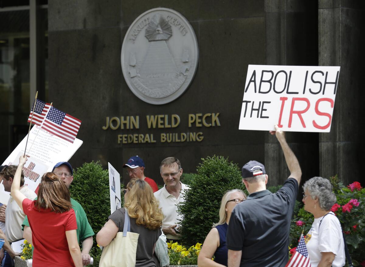 Tea party activists demonstrate outside the John Weld Peck Federal Building, which houses the main offices for the Internal Revenue Service in Cincinnati, Ohio, in 2013.