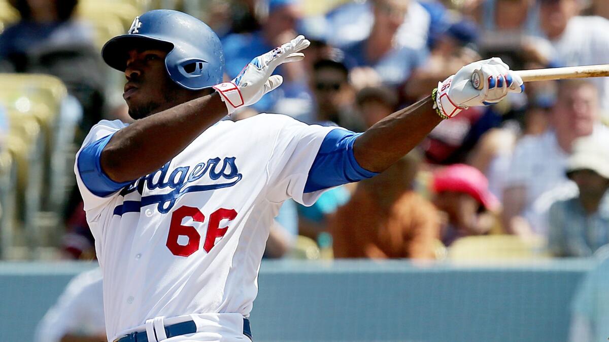 The Dodgers' Yasiel Puig hits a home run against San Diego in September.