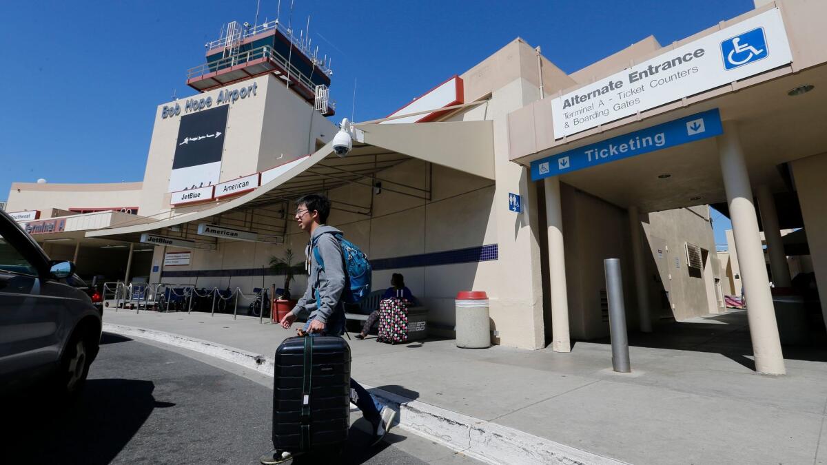 A passenger exits Hollywood Burbank Airport on March 24, 2016.