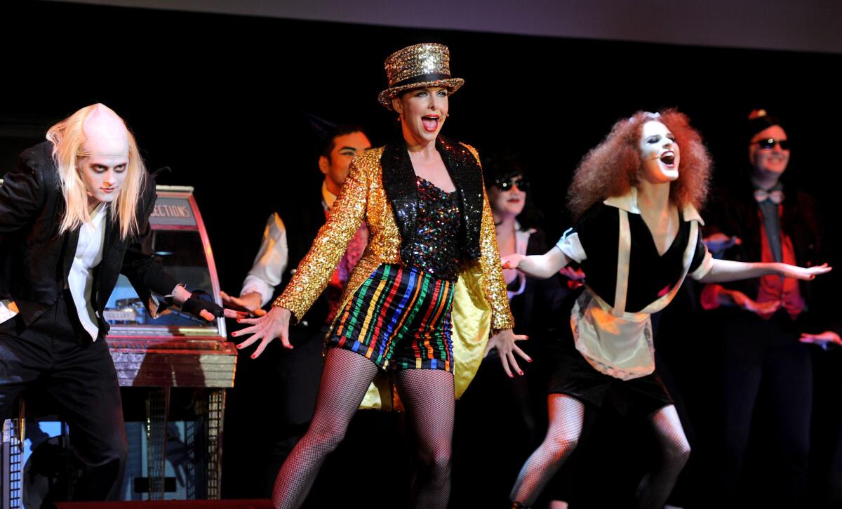 2010 - Actors Lucas Grabeel, Melora Hardin and Evan Rachel Wood perform onstage for "The Rocky Horror Picture Show" 35th anniversary at the Wiltern in Los Angeles.