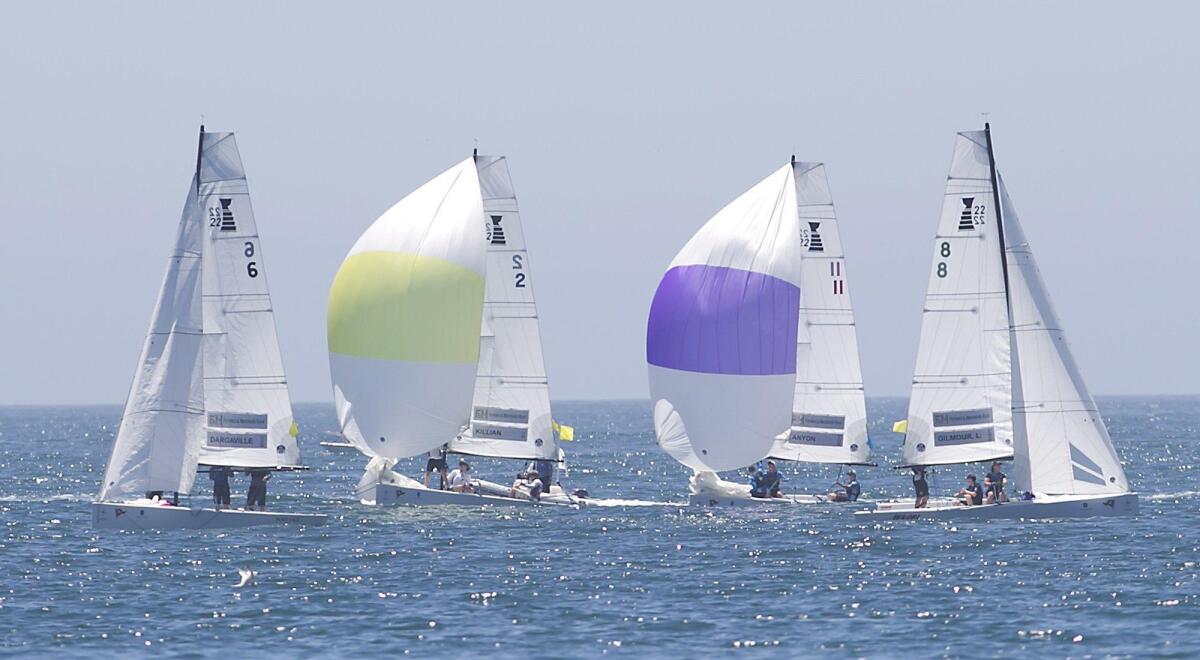 Members of the Balboa Yacht Club team (yellow sail) compete in round-robin racing Friday at the Governor’s Cup International Youth Match Racing Championship off Newport Beach. BYC earned one of four berths in the semifinals, scheduled to be contested Saturday.