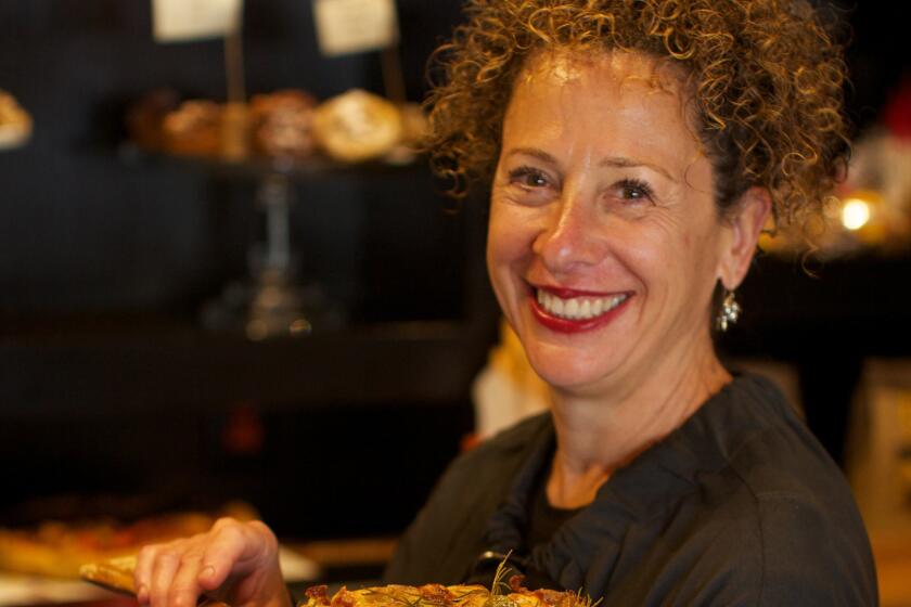 Nancy Silverton, owner of Pizzeria Mozza, shows off her freshly baked focaccia. On Monday she was named Outstanding Chef at the James Beard Foundation Awards. A Los Angeles chef hasn't won the award since 1998.
