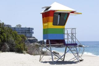 The Pride inspired lifeguard tower at West Street and Camel Point Beach in Laguna Beach on Friday.