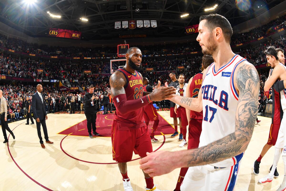 LeBron James, left, and JJ Redick greet each at the end of Cavaliers-76ers game in 2017 in Cleveland.